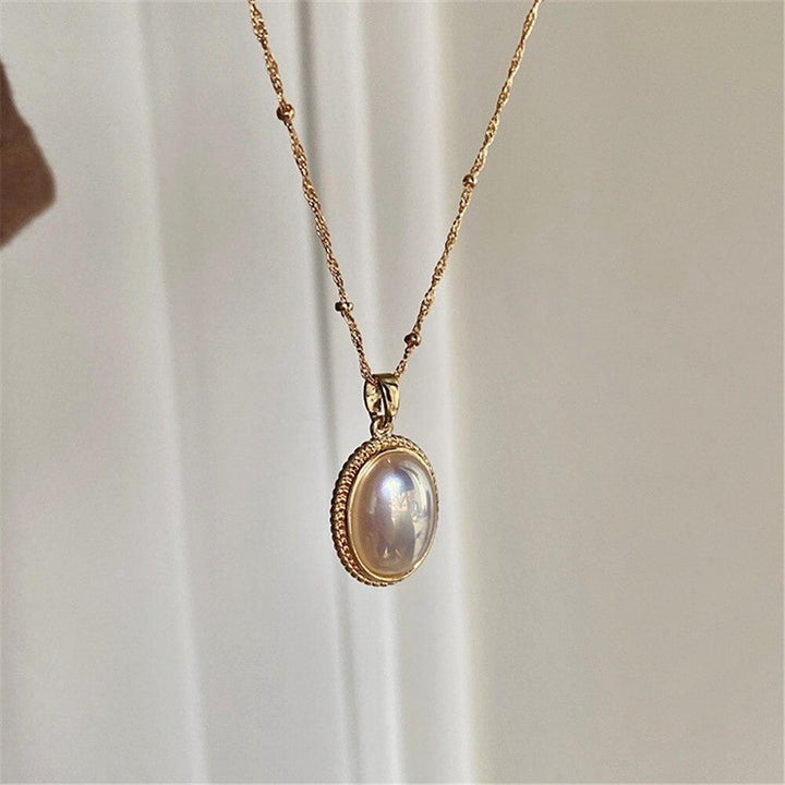 Handcrafted vintage gold necklace with classic pearls. Timeless women's jewelry for elegant style.