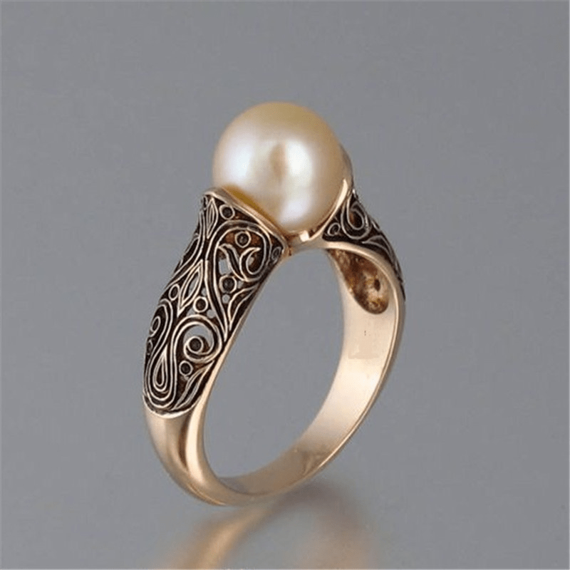 Elegant women's vintage gold ring with a single pearl, handcrafted jewelry, perfect gift.