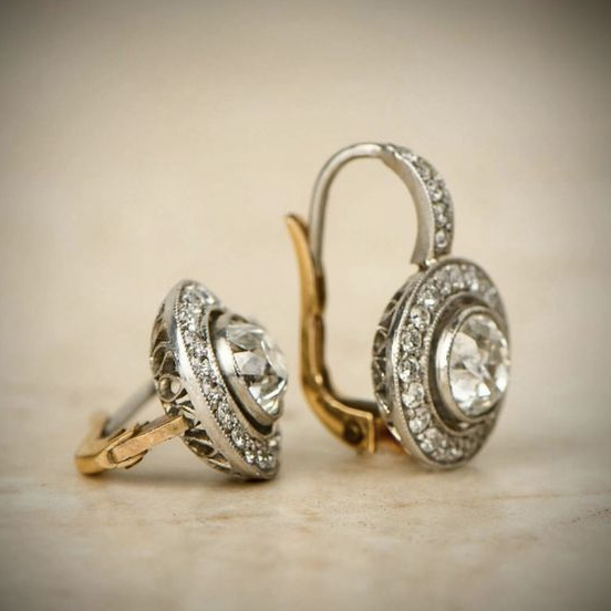 Elegant women's vintage silver drop earrings with sparkling zirconia stones. Classic dangle jewelry.