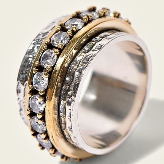 Elegant women's vintage two-tone gold & silver ring featuring sparkling zirconia stones, a chic fashion accessory.