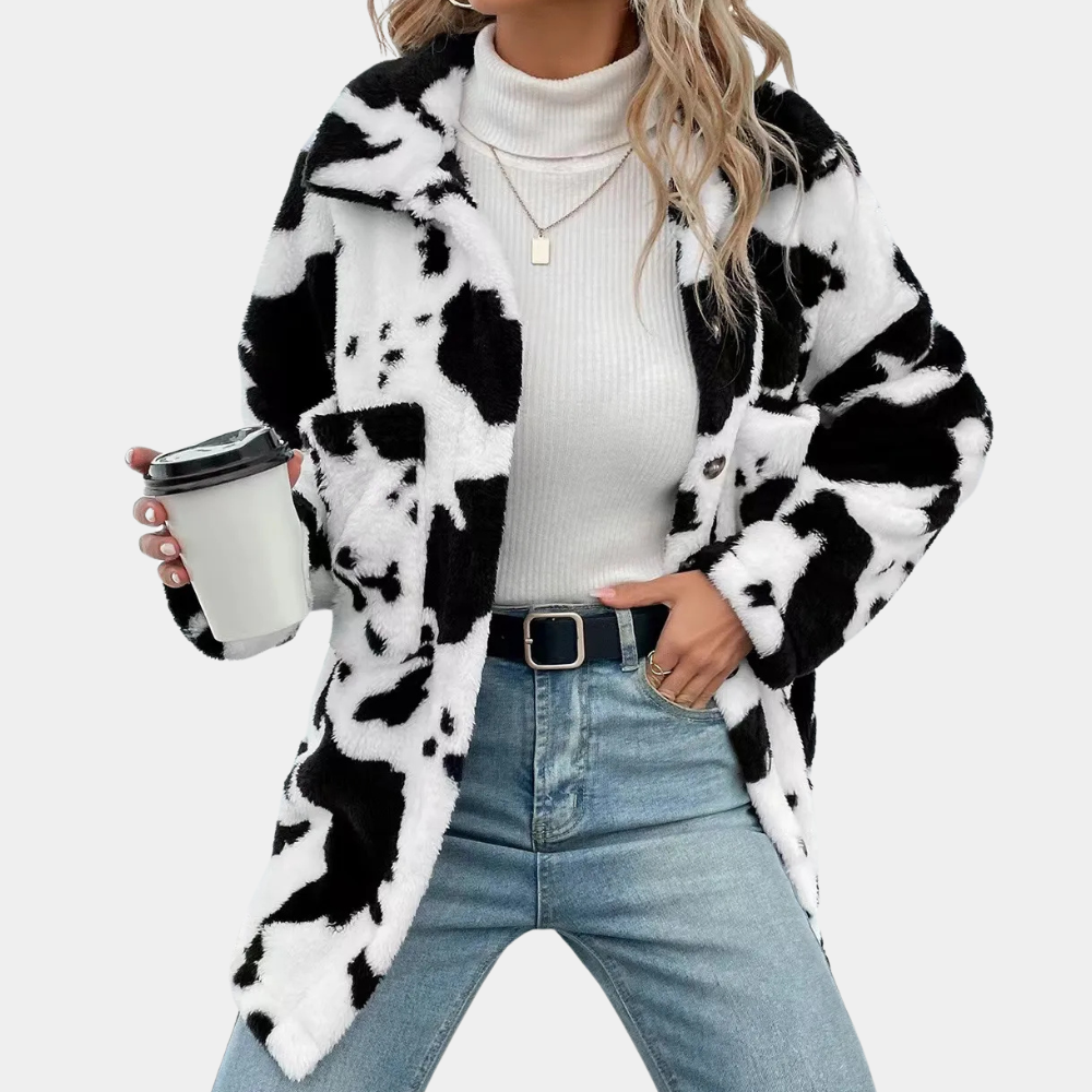 Women's stylish long winter coat in a neutral color, perfect for cold weather and elegant everyday wear.