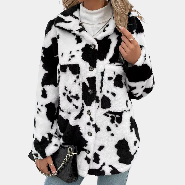 Cozy women's warm winter coat, long-style for ultimate cold weather protection. Stylish winter fashion outerwear.