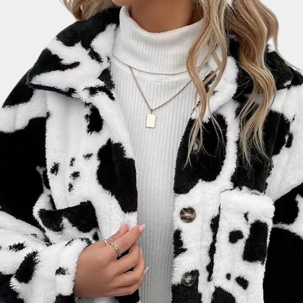 Warm women's winter coat, a stylish and cozy long jacket. Perfect winter outerwear for cold weather elegance.