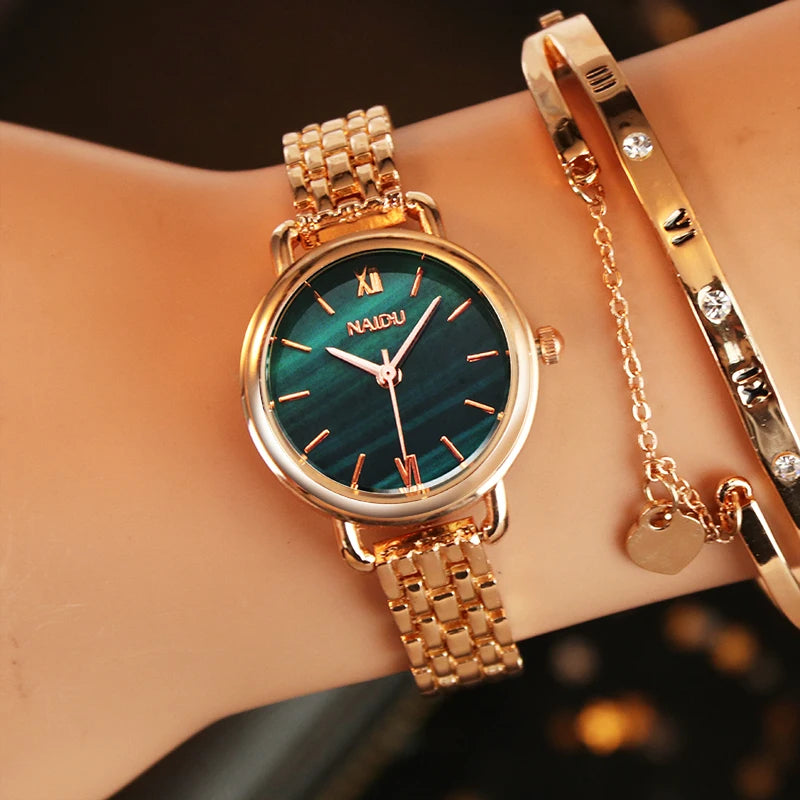 Rose gold women's watch, elegant marble dial & polished stainless steel band. A stylish timepiece.