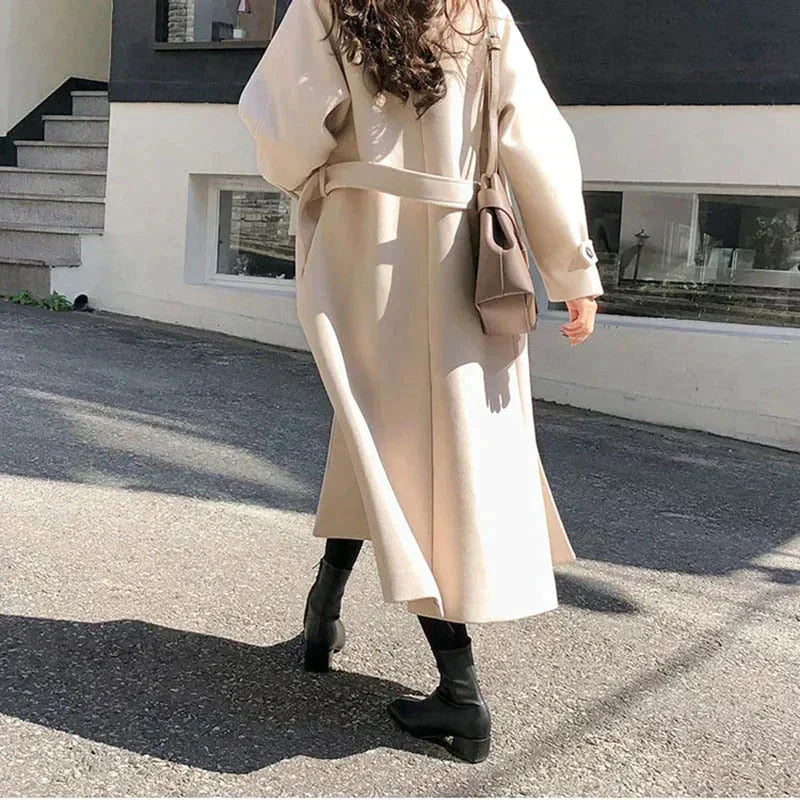 Fashionable women's elegant water-repellent coat in a versatile long design, beige color