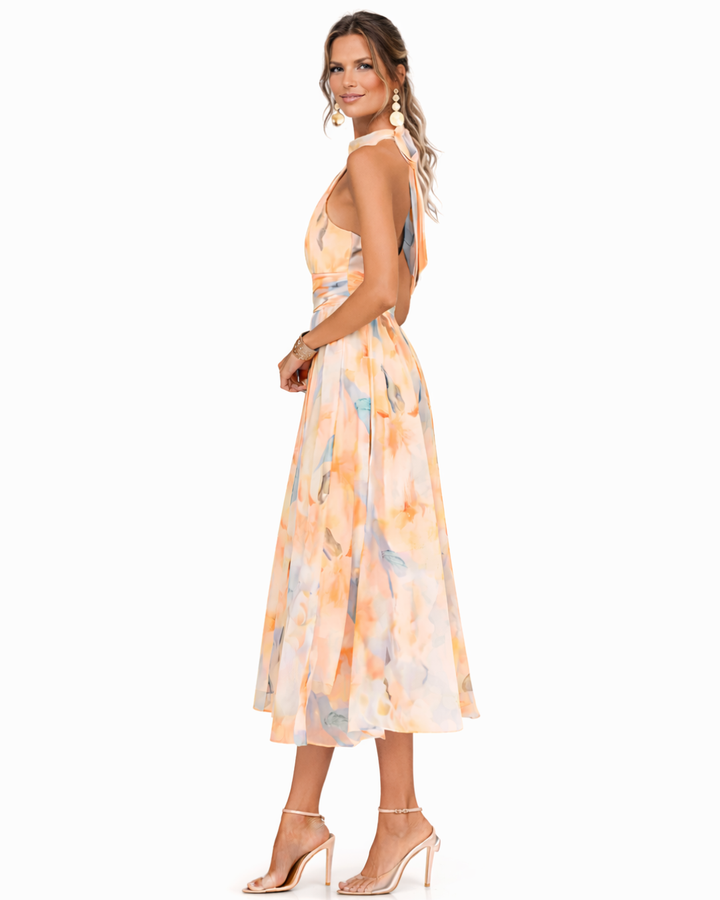 Stylish women's halter neck maxi dress featuring a beautiful watercolor print, offering effortless elegant style.