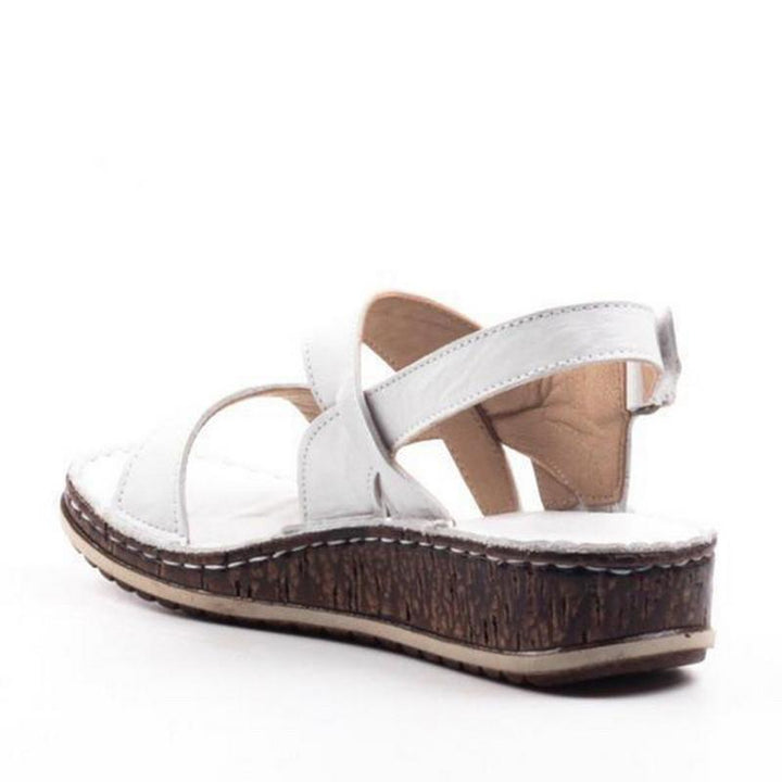 Classic women's elegant wedge sandals, a comfortable summer footwear essential for any wardrobe.