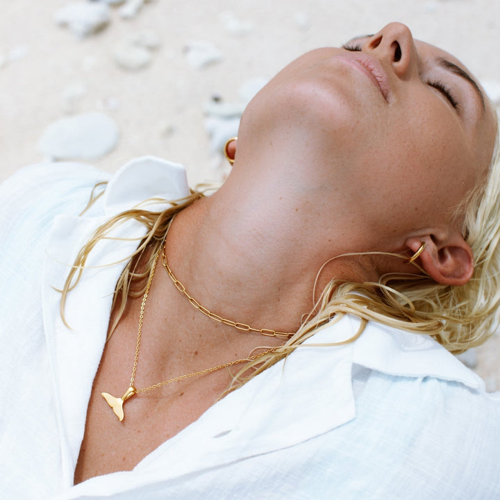Sterling silver whale tail pendant necklace for women. Delicate sea-inspired jewelry, symbolic and chic.