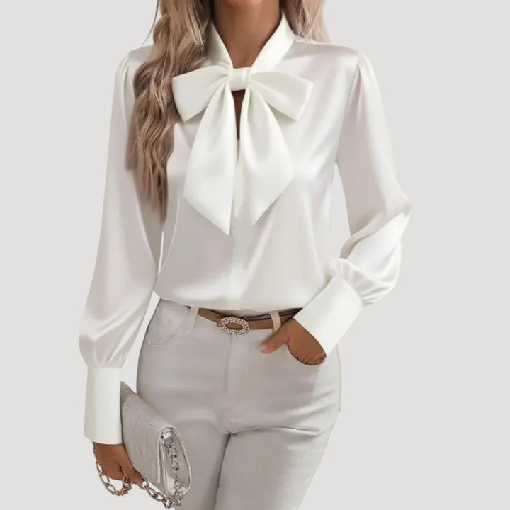 Elegant women's white bow neck long sleeve blouse, perfect for office wear or casual chic style. Timeless fashion top.
