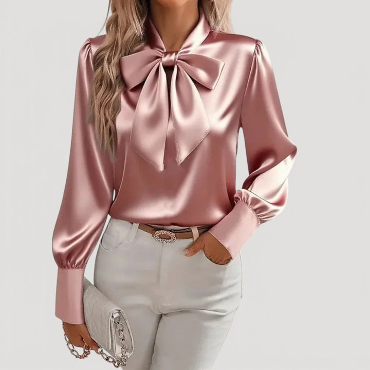 Stylish pink women's long sleeve blouse with an elegant bow neck detail, a fashionable and versatile top for any occasion.