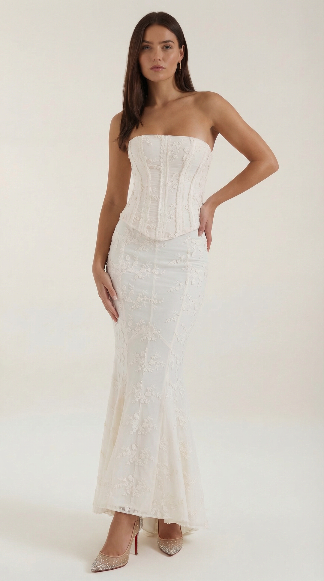 Elegant women's white strapless corset maxi dress with a mermaid silhouette, perfect for formal events or as a bridal gown.