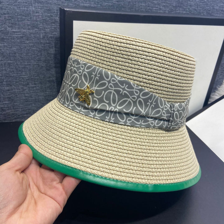 Classic wide brimmed women's hat with an elegant bow accent, great for sun protection and summer style.