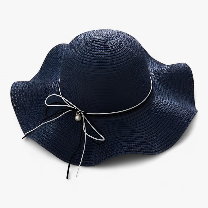 Lightweight BreezeBow sun hat for women, featuring a wide brim and stylish bow, ideal for summer accessory
