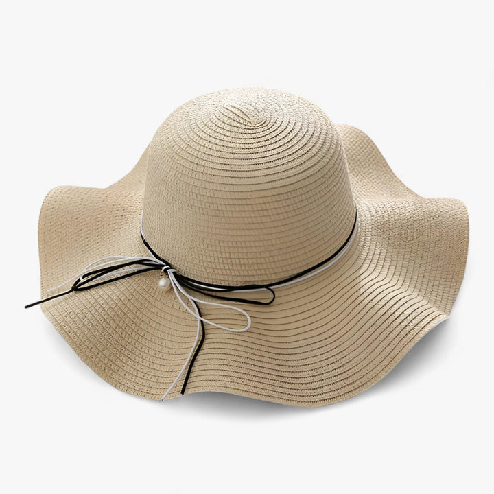 Adjustable summer hat for women featuring a chic bow and wide brim for sun protection and elegant style