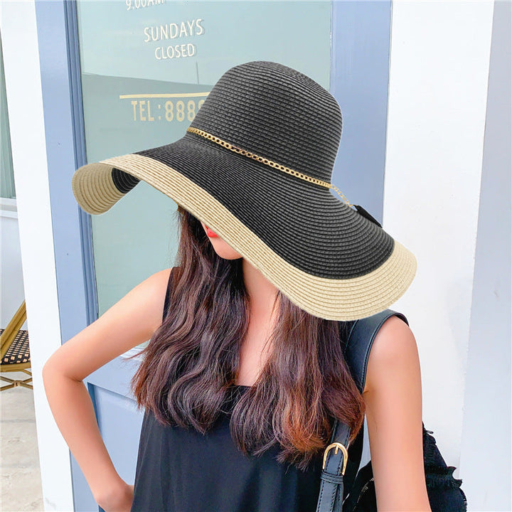 Fashionable 'Lily' women's wide brim beach hat, designed for sun protection and summer style.