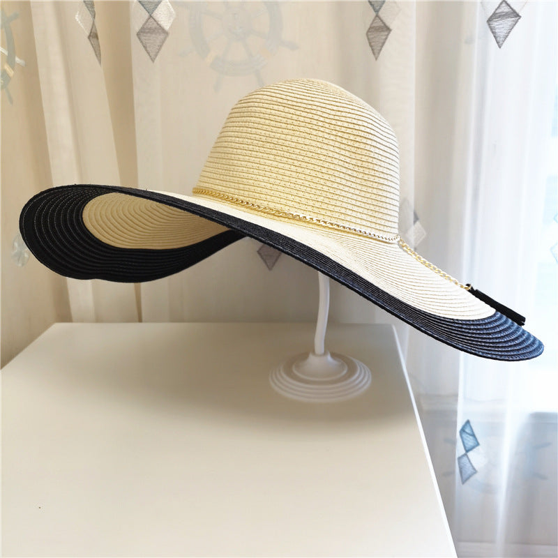 Women's 'Lily' wide brim hat, a summer essential for UV protection and a chic beach look.