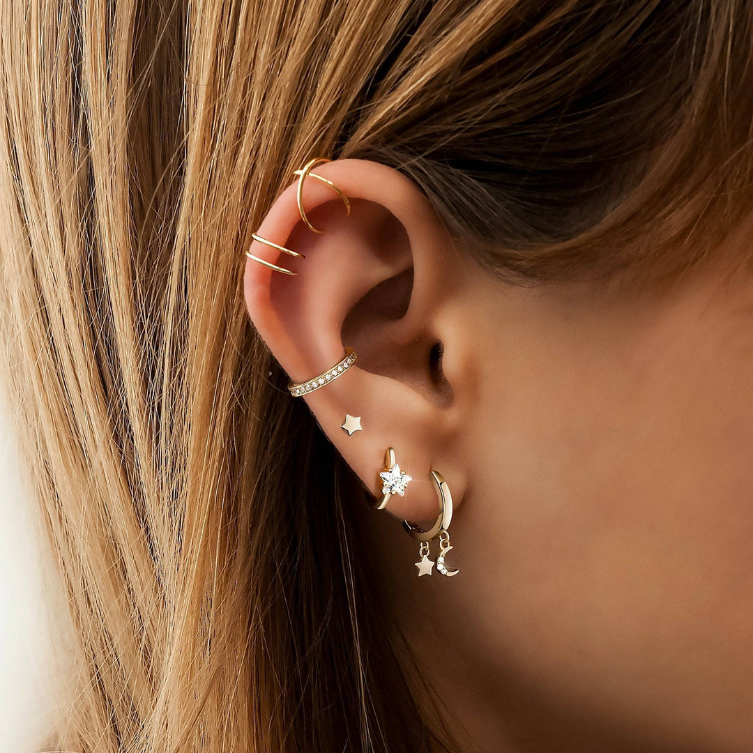 Stunning women's wide hoop earrings in silver or gold, featuring sparkling star zirconia for a bold statement.
