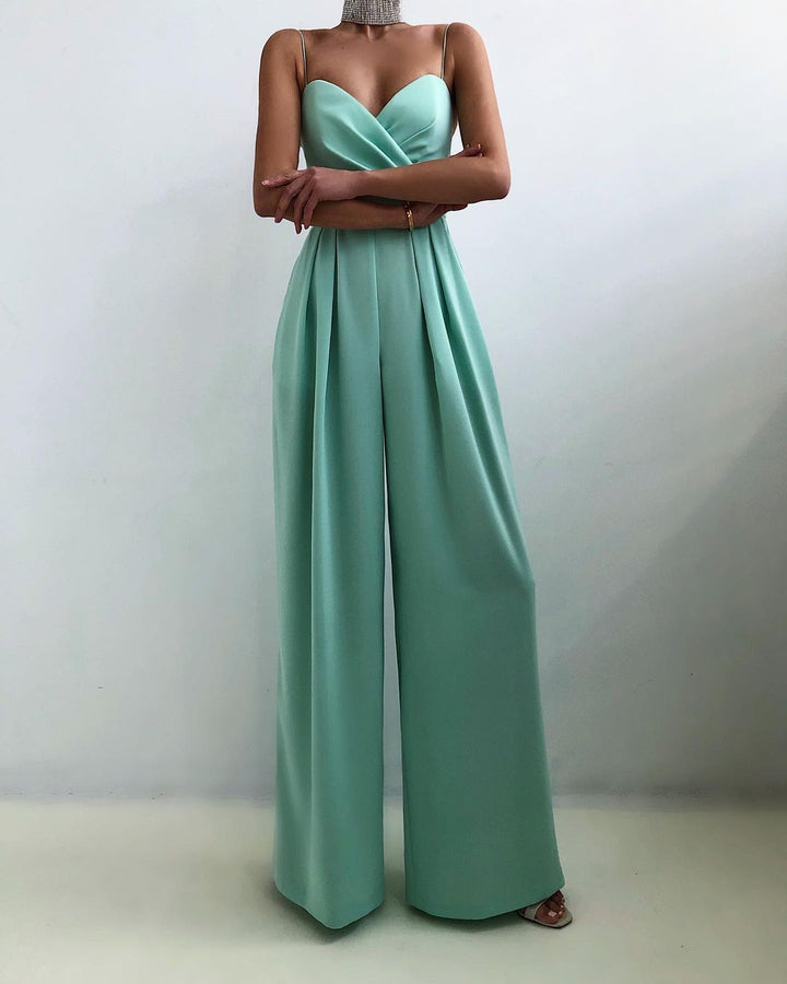 Chic black wide-leg jumpsuit with spaghetti straps, ideal for parties, evening events, and special occasions.