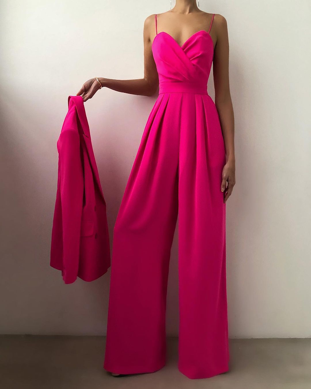Stunning turquoise sleeveless wide-leg jumpsuit for women, an elegant spaghetti strap outfit for formal occasions.
