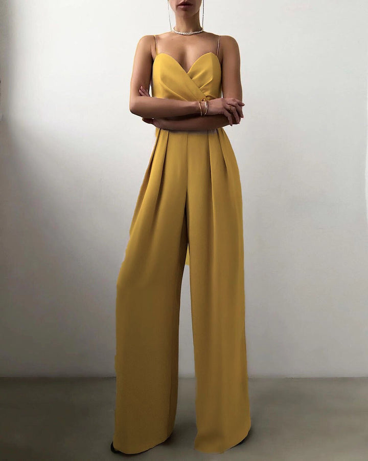 Vibrant yellow wide-leg jumpsuit with spaghetti straps, a comfortable & chic choice for elegant evening outfits.