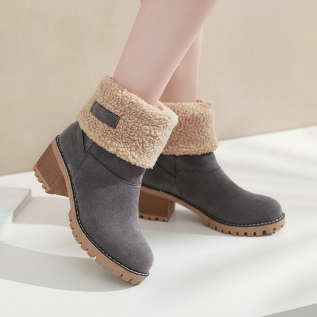 Side view of black women's winter boots with faux fur lining and a comfortable, fashionable heel