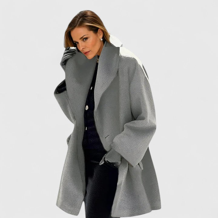 Women's elegant winter coat, providing cozy warmth & timeless style. Essential ladies jacket for cold weather fashion.