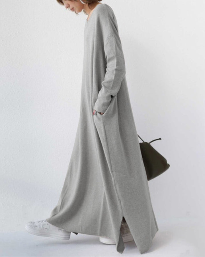 Full-length women's winter dress with long sleeves, providing warmth and sophisticated appeal.
