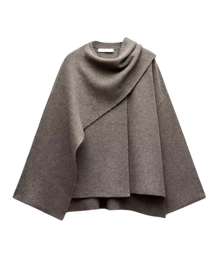 Elegant women's winter poncho shawl, chic layering piece.