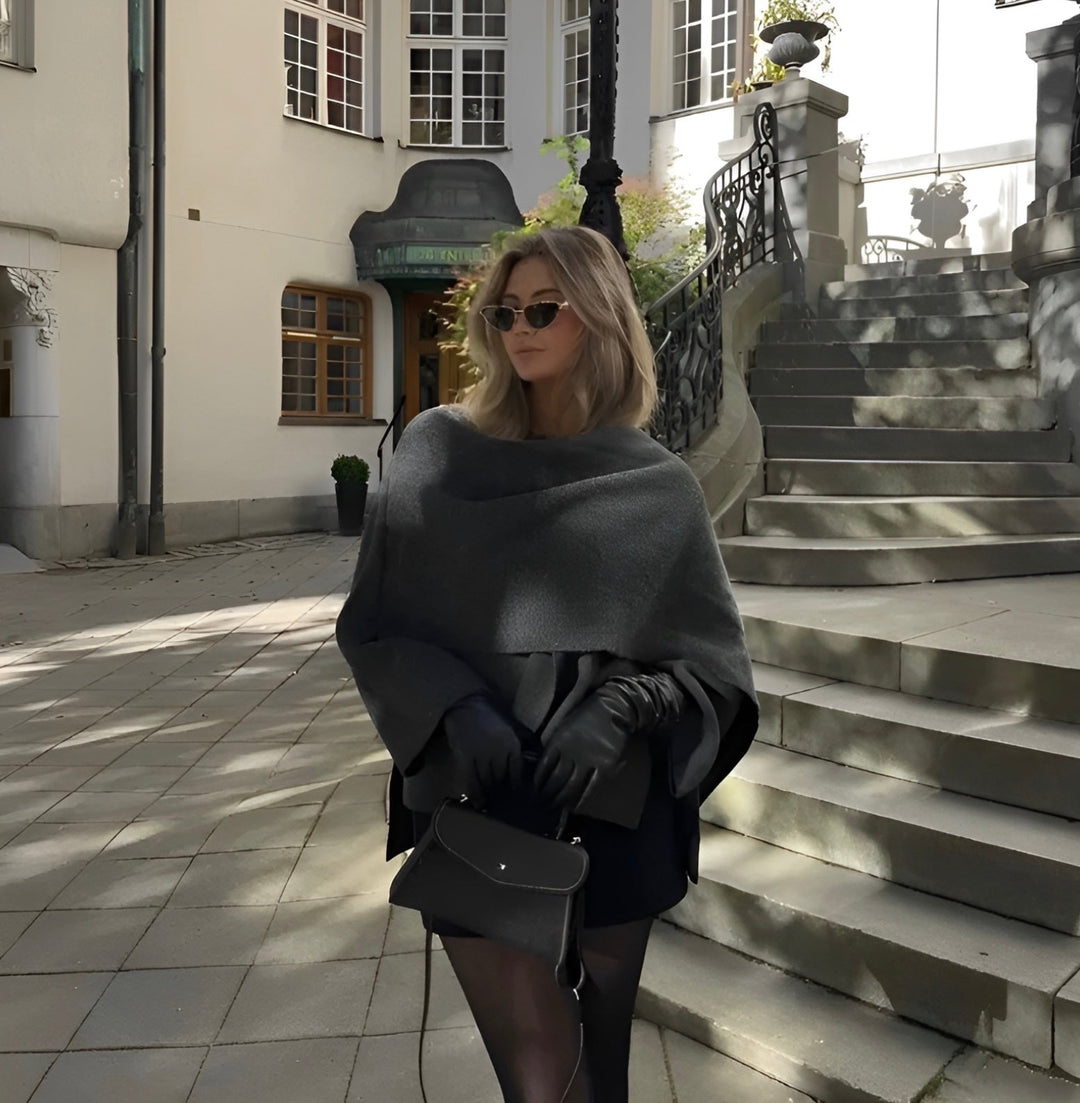 Women's elegant asymmetrical poncho, warm winter fashion top.