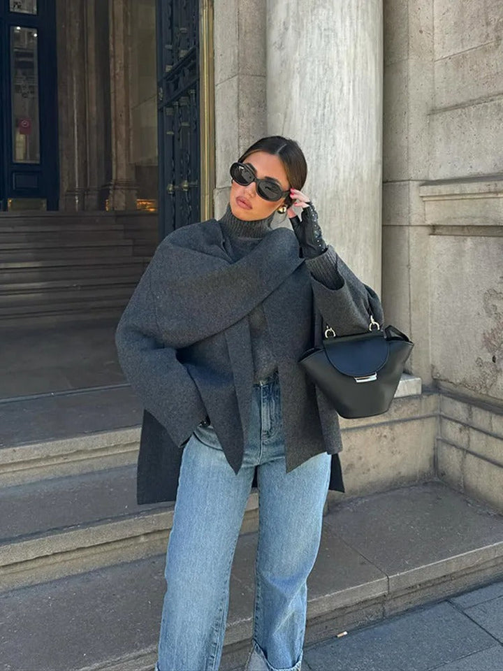 Stylish women's winter poncho outerwear, elegant wrap top.