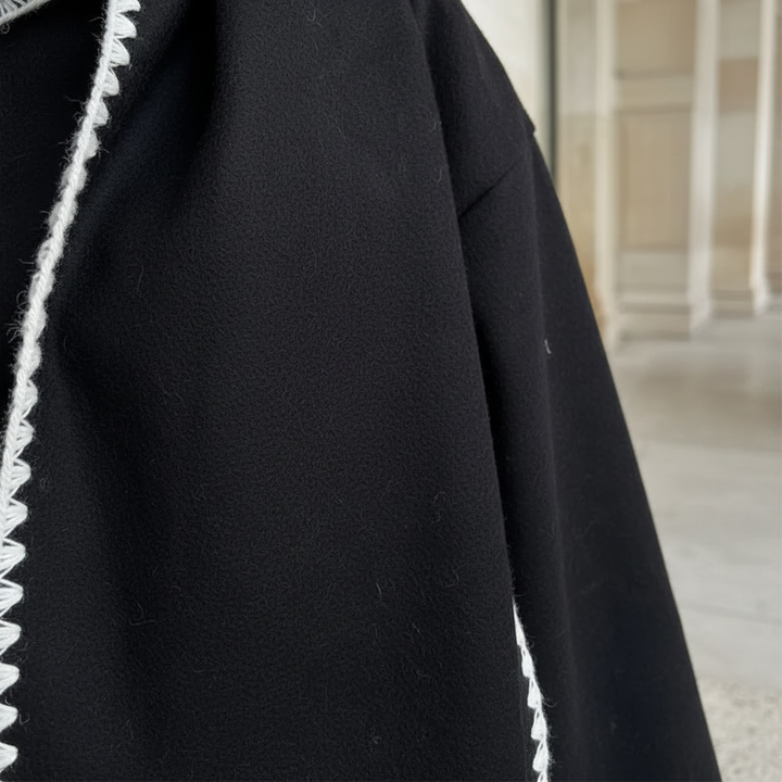 Stylish women's long coat made from a luxurious wool blend, ideal for winter fashion