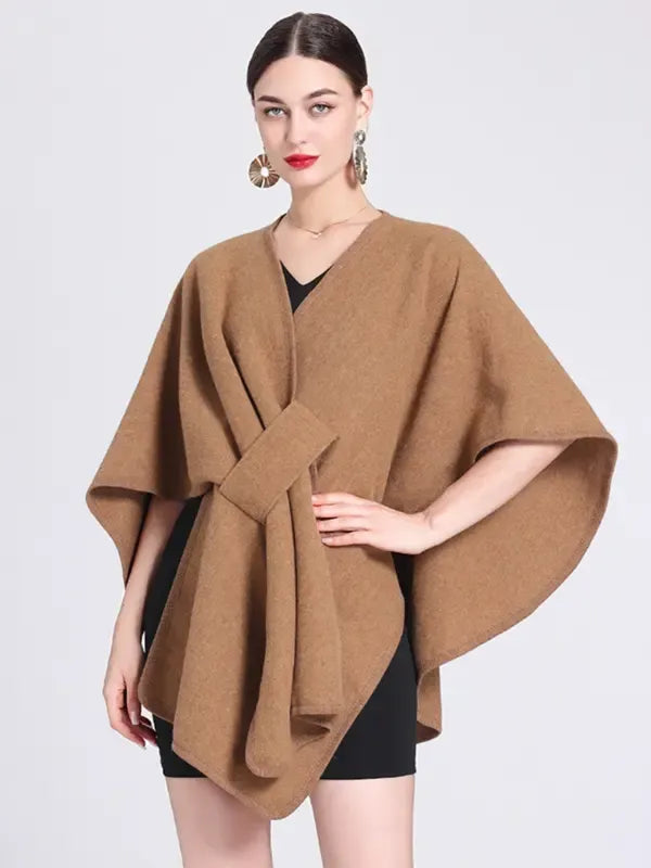 Chic women's wrap cape blouse. Modern elegant top, ideal for professional workwear or stylish casual outfits.