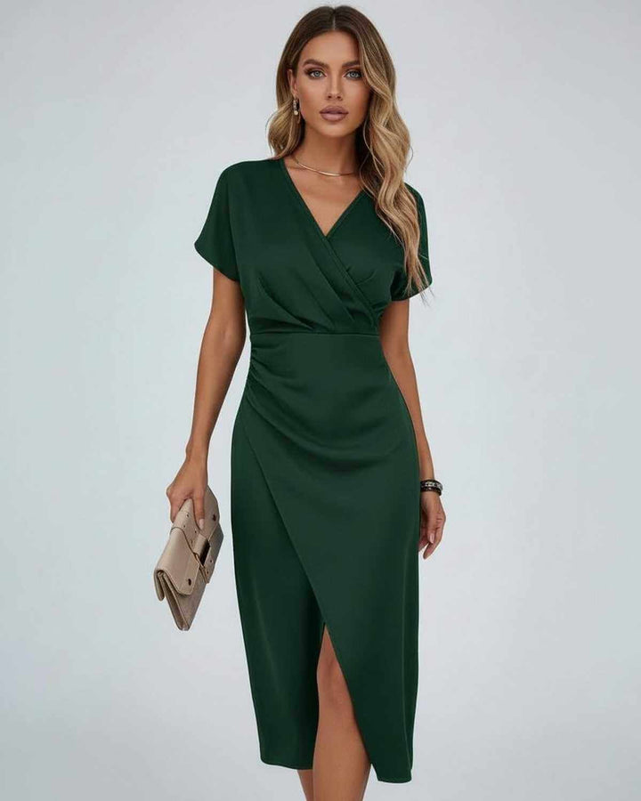 Versatile women's midi wrap dress with short sleeves, V-neck, and chic split hem, suitable for casual or party wear.