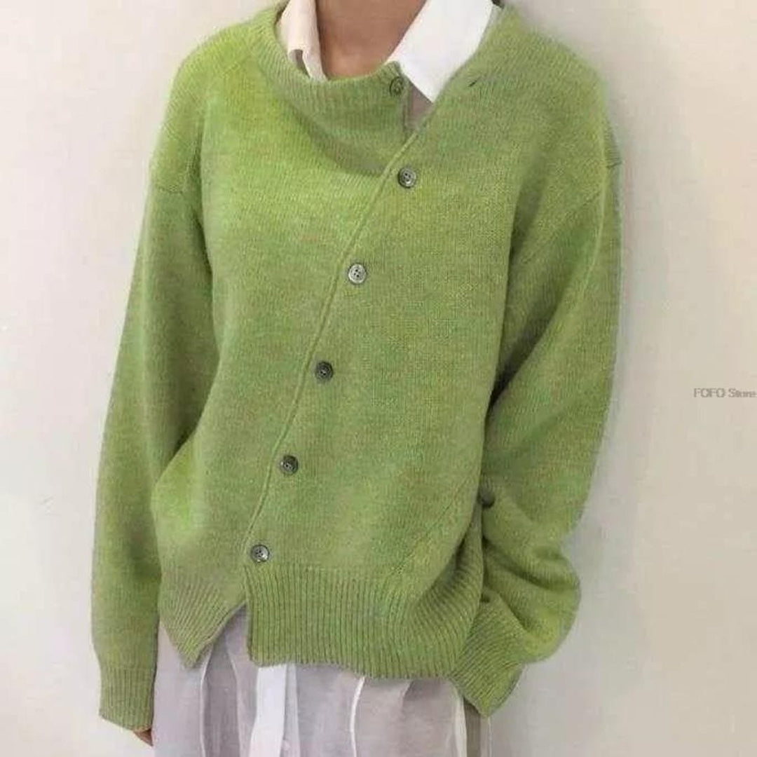 Soft cashmere-blend women's elegant wrap vest with prominent button details, perfect for modern fall wear.
