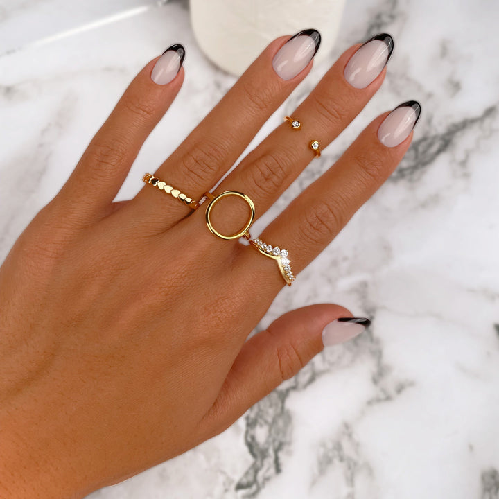 Close-up of a shimmering sterling silver crown ring with brilliant zirconia, an elegant women's fashion ring.
