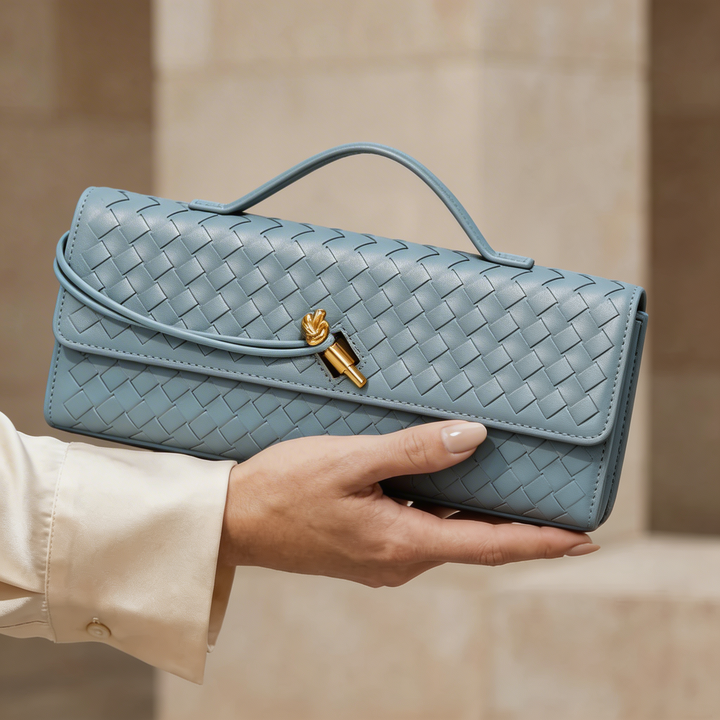 Luxurious emerald woven leather clutch purse, an elegant accessory for women.