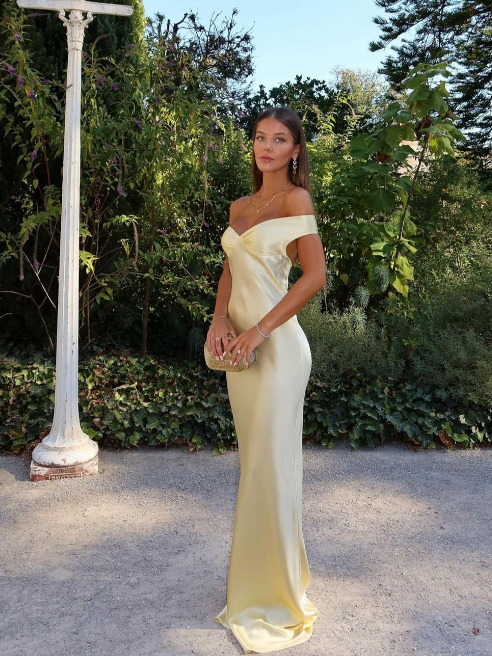 Elegant yellow off-shoulder maxi wedding guest dress with sweetheart neckline. Perfect formal evening gown for women.