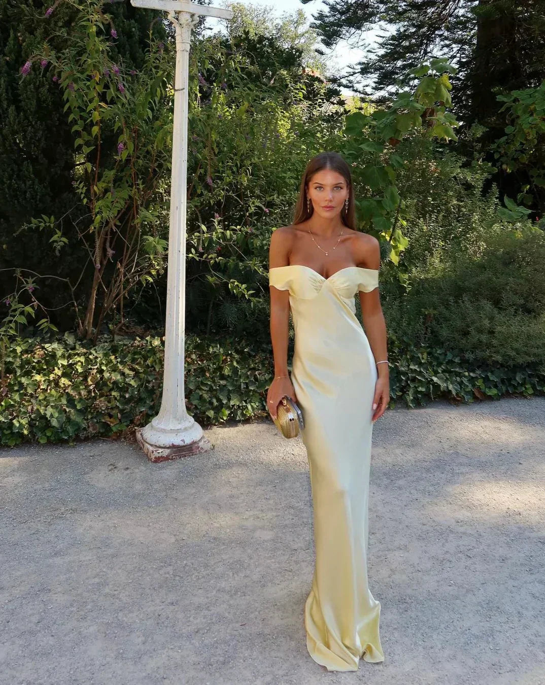 Chic women's yellow off-shoulder maxi dress, ideal as a wedding guest or special occasion formal evening gown.