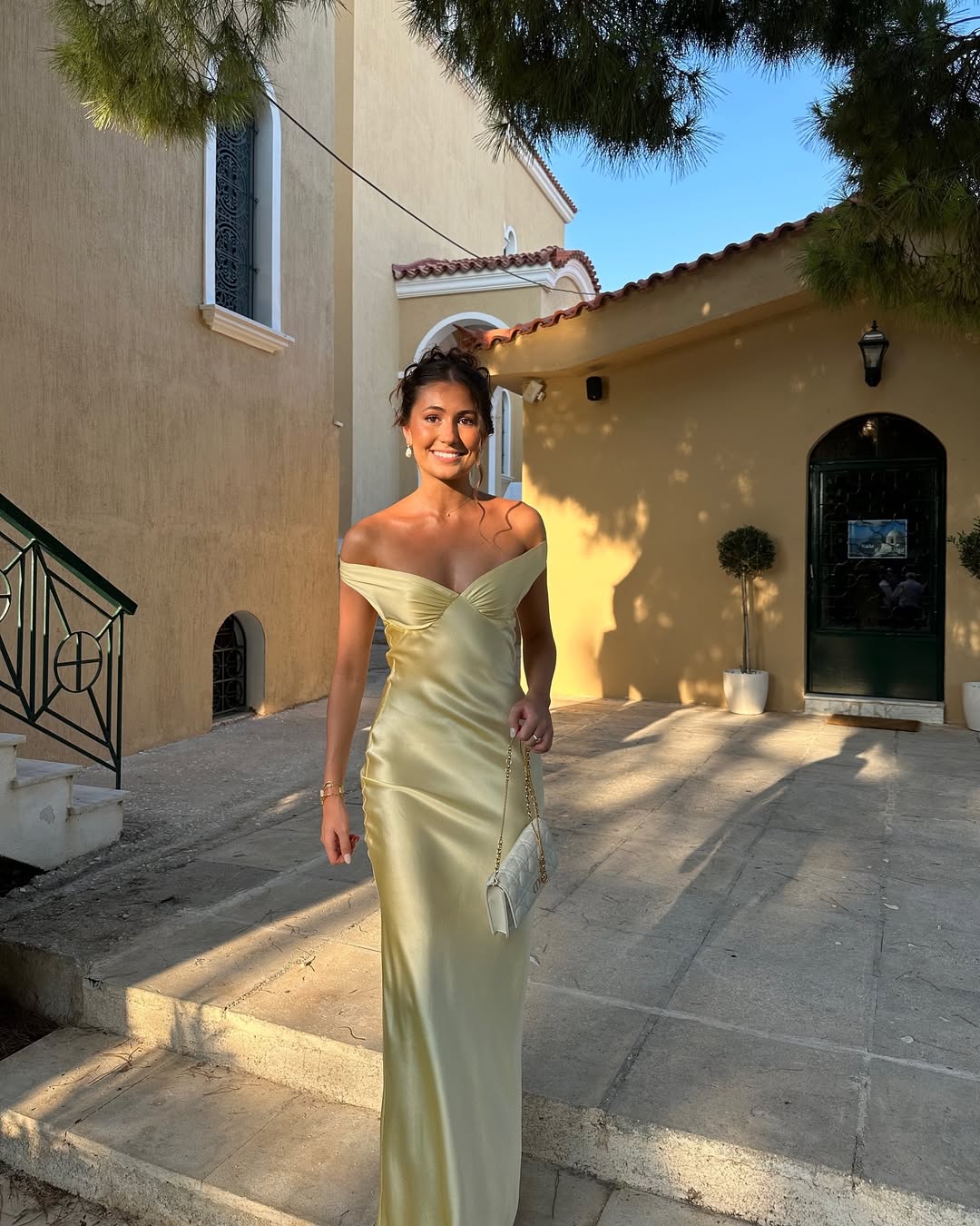 Stunning yellow off-shoulder maxi wedding guest dress for women. Features a sweetheart neckline and elegant design.