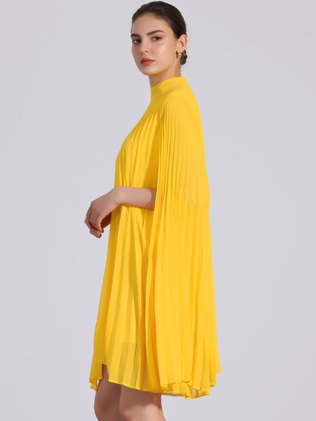 Stylish women's yellow pleated mock neck swing dress with elegant cape sleeves for evening fashion.