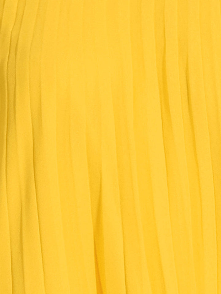 Fashionable yellow pleated swing dress with mock neck and cape sleeves, a perfect women's party dress.