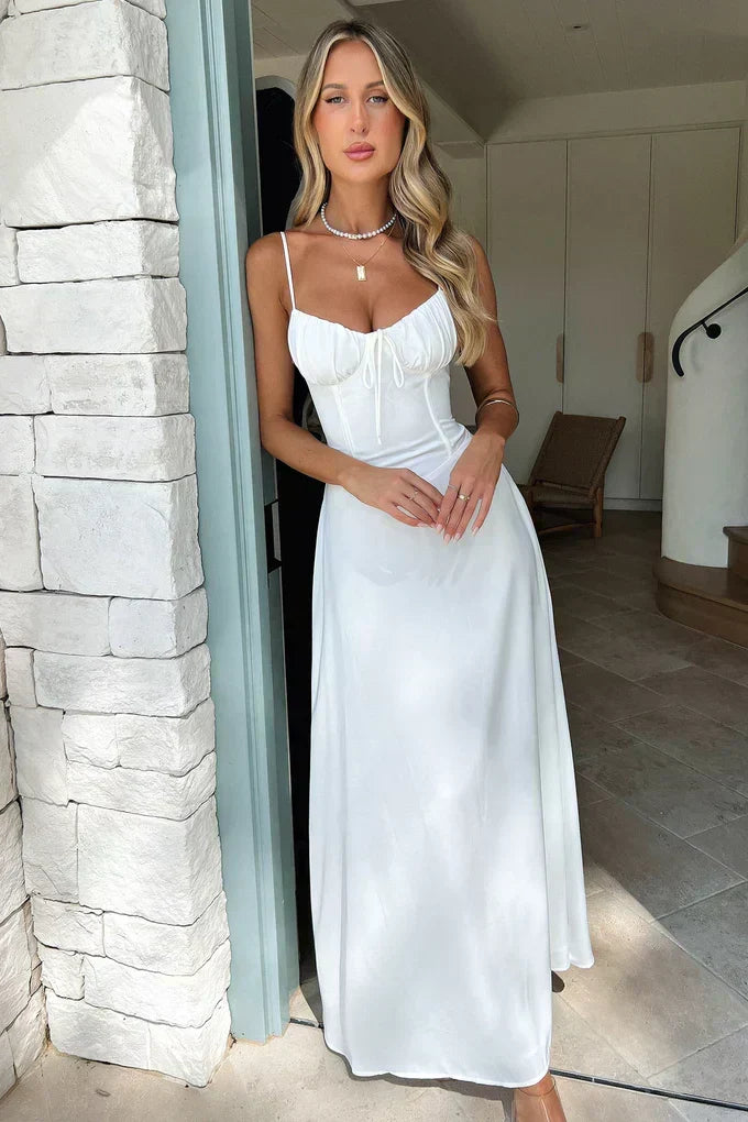 Romantic white sweetheart neckline maxi dress for women, a chic corset wedding guest or formal party dress.