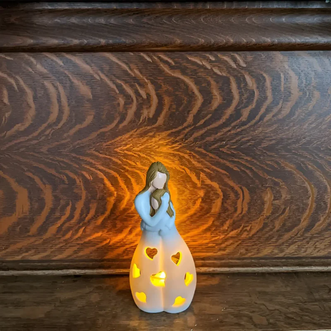 Embracing mother & daughter figurine candle holder, symbolizing eternal family love and home decor.