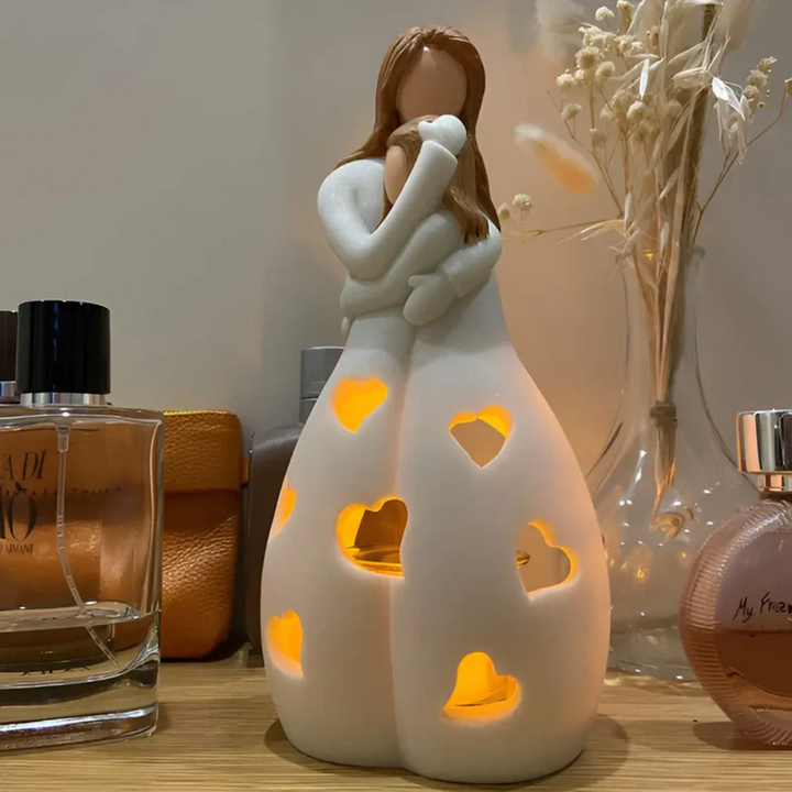 Sculptural embracing mother & daughter candle holder figurine, decorative family love home accent.