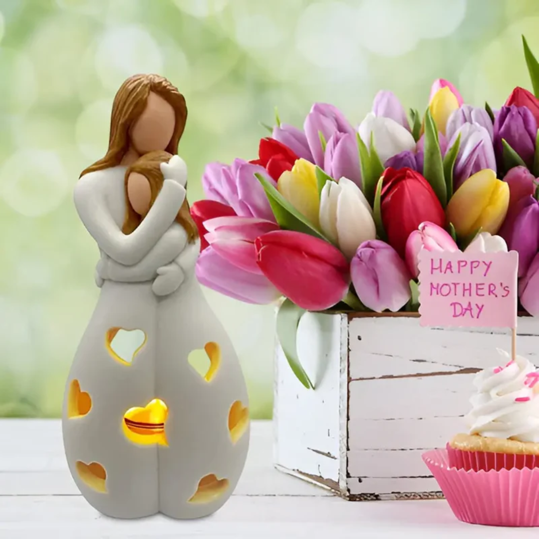 Beautiful embracing mother & daughter figurine candle holder, a decorative symbol of family love.