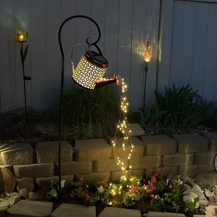 Enchanting solar garden light creating a stunning LED star shower effect for outdoor decor and patio lighting.