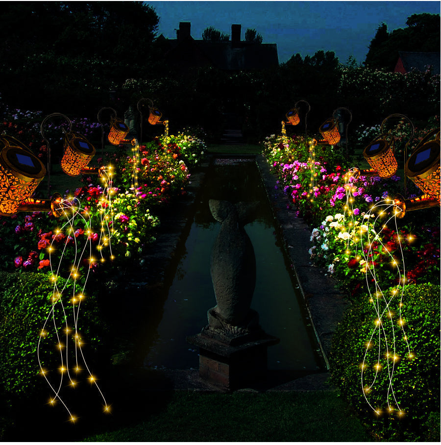 Magical LED star shower solar light illuminating a garden at night, perfect for decorative outdoor lighting.