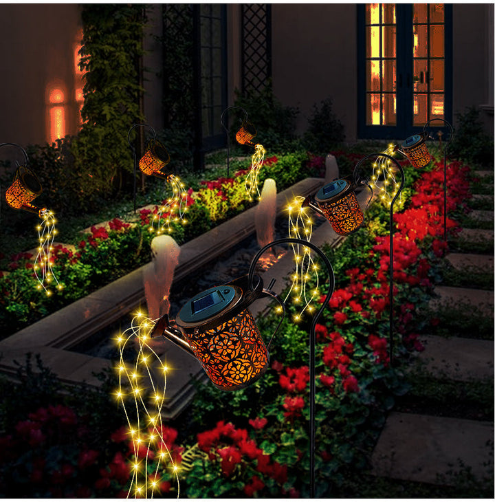 Decorative solar garden lamp with unique LED star shower waterfall effect, ideal for patio and outdoor decor.