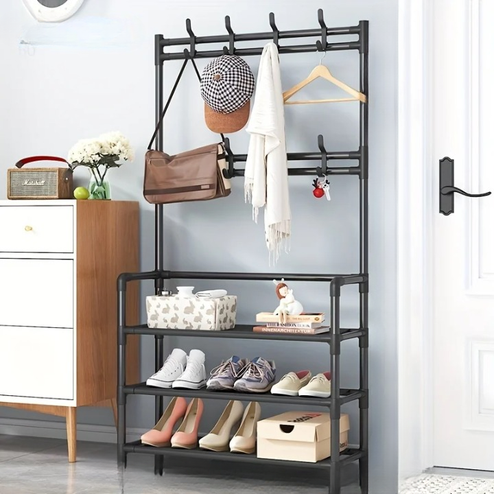 Detail of a multi-layer steel coat rack's shoe storage section, empty shelves