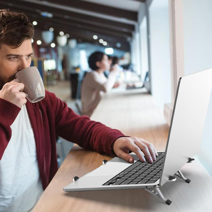 Foldable notebook mount, adjustable height & angle, promoting airflow for laptop cooling on desk